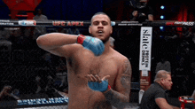 a man in a boxing ring with a sign that says ' slate protein drinks '