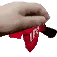 a close up of a person 's hand holding a red lego block with the word ler on it .