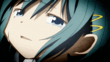 a close up of a girl 's face with a yellow m on her hair