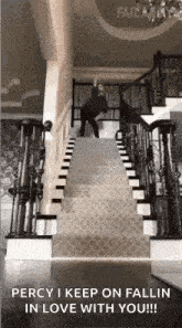a man is jumping down a set of stairs .