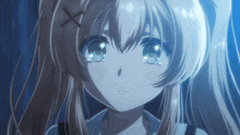 a close up of a girl with a cross on her hair