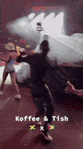 a man and a woman are dancing in front of a sign that says koffee & tish x x
