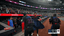 a baseball game is being played in a stadium sponsored by rogers