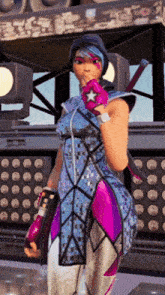 a woman in a purple and blue outfit is standing in front of a stage