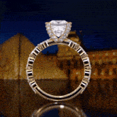 a gold ring with a large diamond in the middle