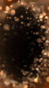 a black background with a circle of sparkles on it