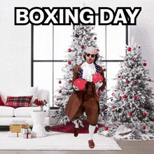 a man wearing boxing gloves is dancing in front of a boxing day poster