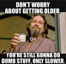 a man in a robe is holding a glass of milk with a caption that says " don t worry about getting older "