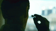 Wearing Earbuds The Killer GIF - Wearing Earbuds The Killer Michael Fassbender GIFs