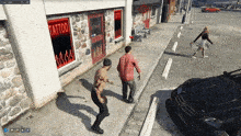 a video game scene with a tattoo shop on the side of a building