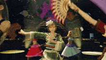 a group of women are dancing in front of a sign that says ' big show '