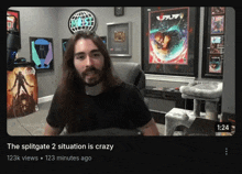 a video of a man with long hair and a beard is titled the splitgate 2 situation is crazy