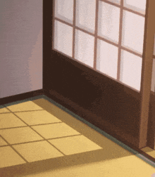 a corner of a room with a sliding glass door and a tiled floor