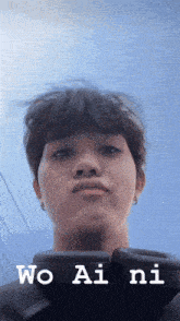 a close up of a person 's face with the words wo ai ni written on the bottom