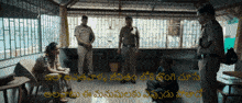 a group of police officers talking to a man in a room