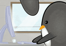 a penguin is standing in front of a computer screen