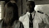 a man with a police lanyard around his neck