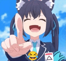 a girl in a suit and tie is pointing at the camera while laughing .