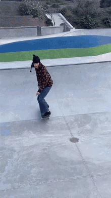 a person riding a skateboard down a ramp with a pool in the background