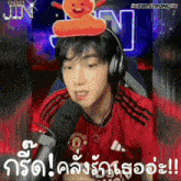 a man wearing headphones and a red shirt with a gingerbread man on his head