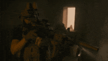 a man is holding a rifle with a scope that says ' a ' on it