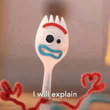 a plastic fork with googly eyes and mouth and the words i will explain below it
