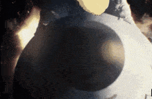 a close up of a person 's face with a yellow circle in the middle