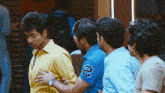 a man in a blue shirt with the number 2 on the sleeve