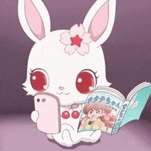 a white rabbit with a flower on its head is holding a cell phone and a book .