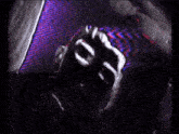 a close up of a person 's hand on a colorful background