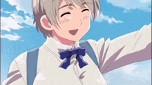a cartoon character with a blue bow on his shirt is smiling