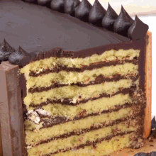 a cake with a slice taken out of it and a kitkat bar in the background