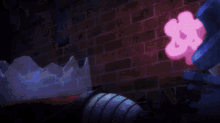 a man in a green sweater is holding a sword in a dark room