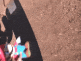 a blurred image of a person playing a game on a cell phone