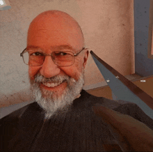 a man with glasses and a beard is smiling in front of a wall with the letters nw on it