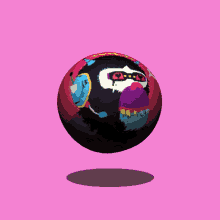 a colorful ball with a monkey face painted on it