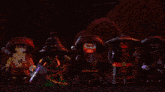 a group of ninjago characters are lit up in red lights