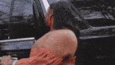 a woman looks out the window of a car with the word zeusa on the bottom right