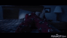 a person is laying in bed with a teddy bear in their lap