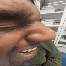 a close up of a person 's face with their eyes closed .
