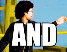a man with an afro stands in front of a sign that says and