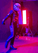 a man wearing a red bull helmet is running