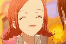 a close up of a girl with red hair making a funny face .