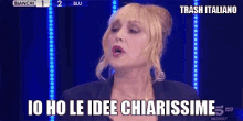 a woman in a blue jacket says trash italiano