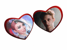two red heart shaped mirrors with a woman and a man on them