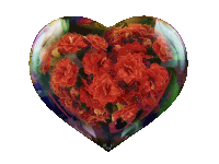 a heart shaped glass container with red flowers inside