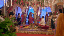 a bride and groom are getting married in front of their family