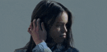 a close up of a woman 's face with a blurred background