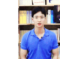 a man in a blue shirt is standing in front of a bookshelf with a book titled give you my galaxy