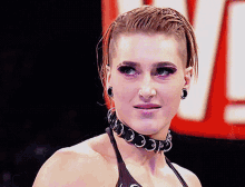 a woman with a choker around her neck and earrings